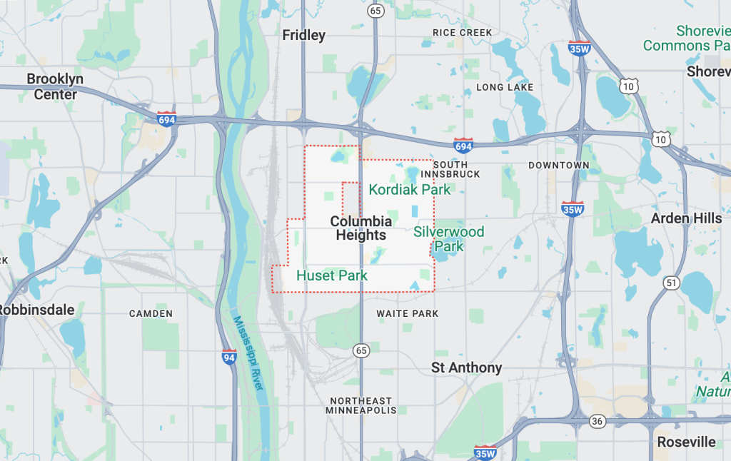 Tow truck assisting a stranded car in Columbia Heights, MN.