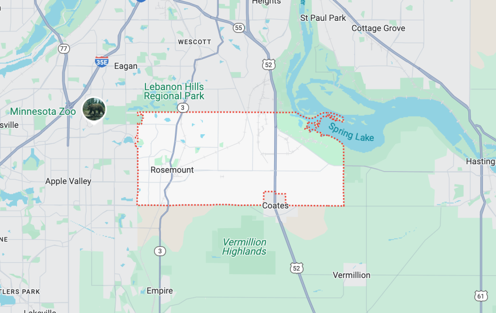 Tow truck assisting a stranded vehicle on a roadside in Rosemount, MN.