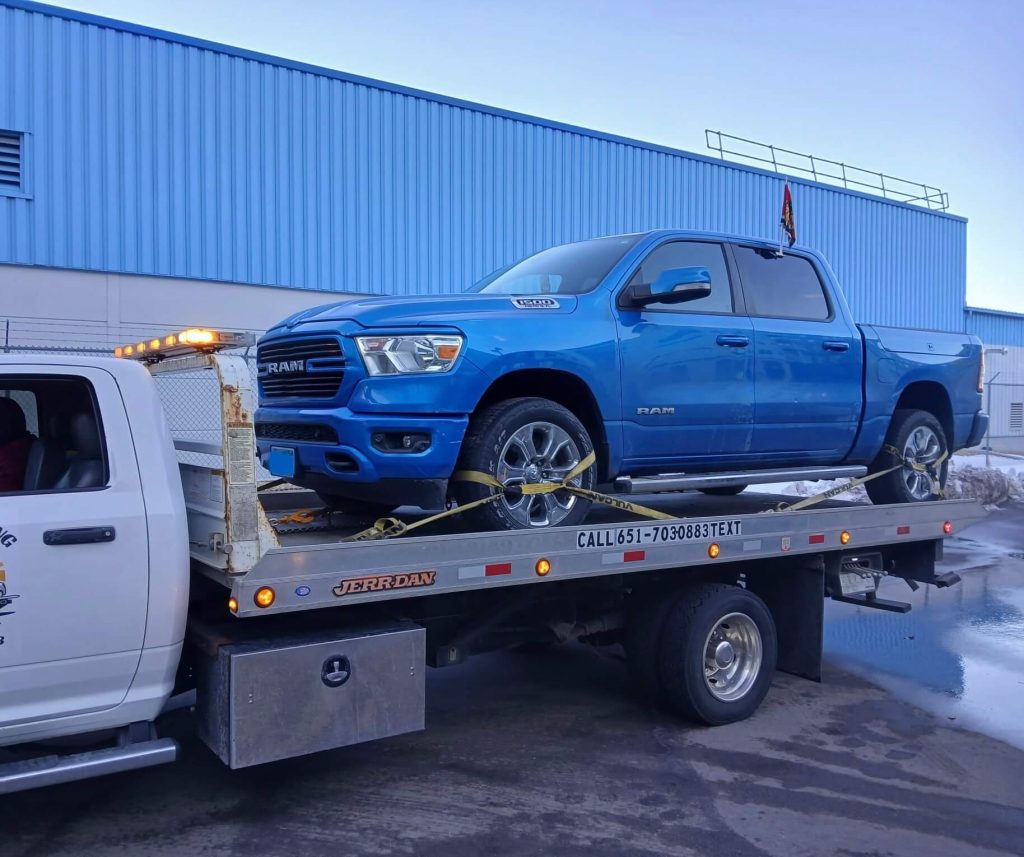 Professional tow truck operator providing emergency St Paul towing service